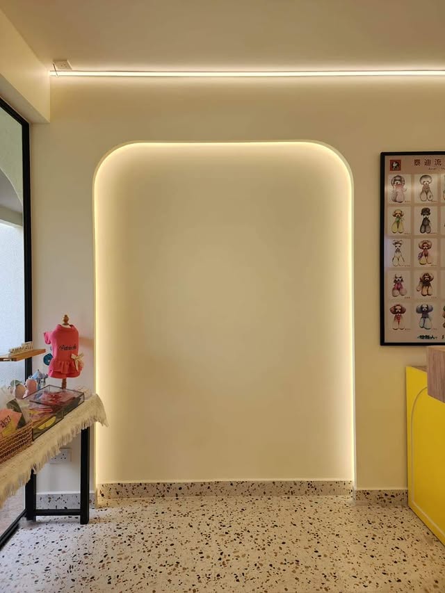Backlit arched feature wall with terrazzo floor