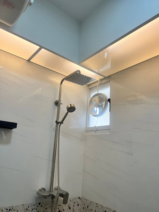 Bathroom shower with cove ceiling and ventilation cover detail